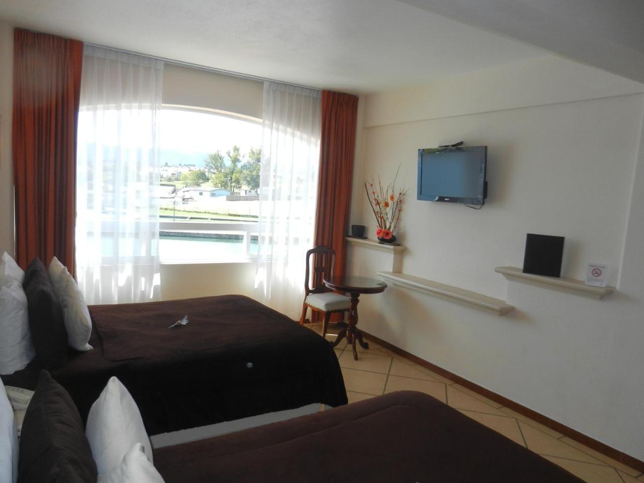 צ'יגנהופאן Hotel 9 Manantiales מראה חיצוני תמונה